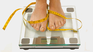 Image of person with feet on weighing scale